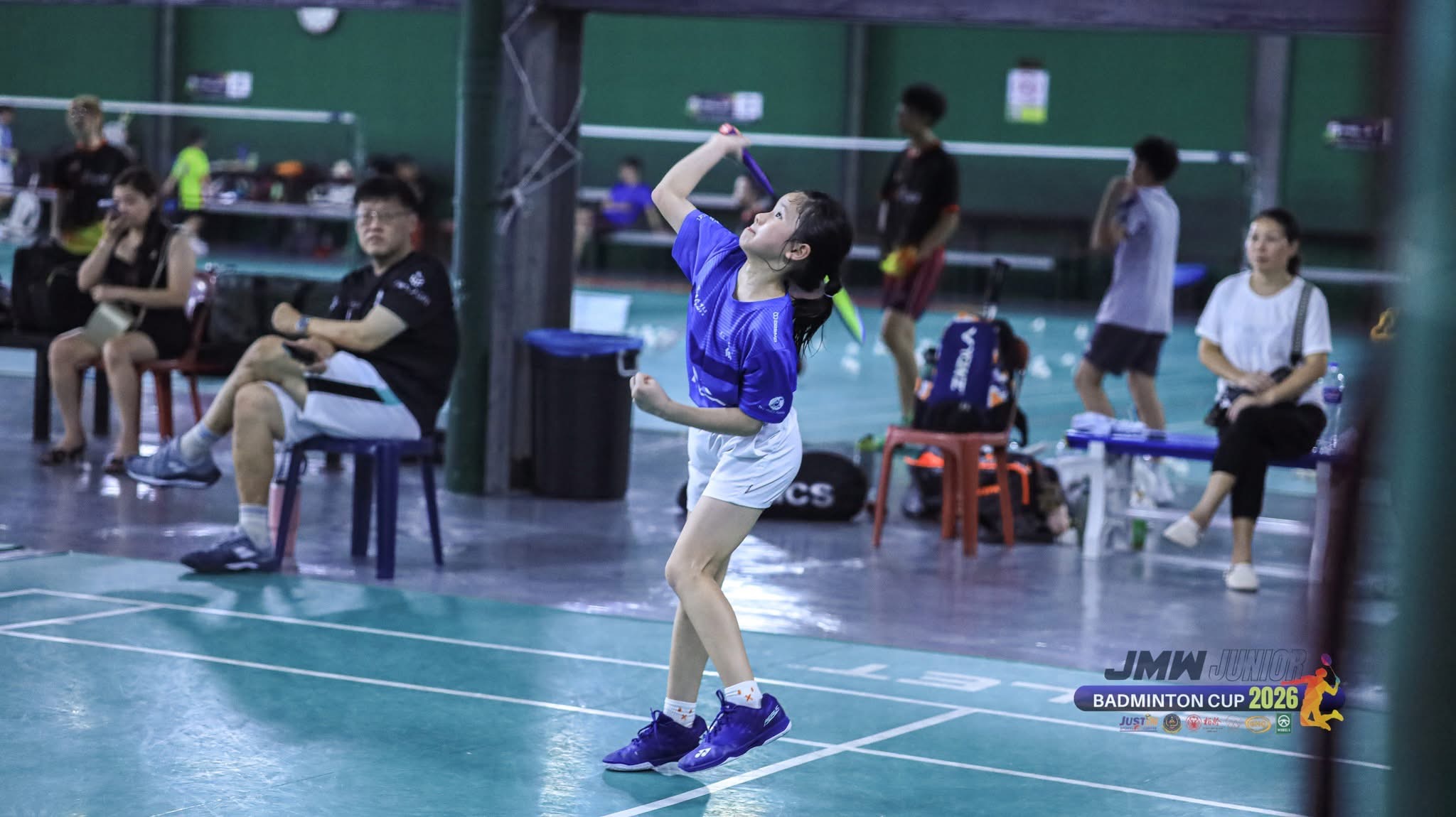 KSA player striking the shuttle at the JMW Junior Badminton Cup 2026