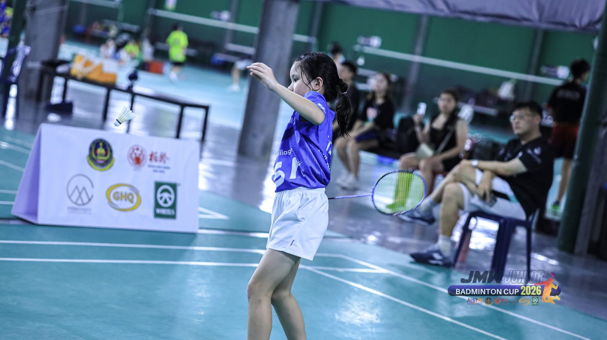 KSA player attacking the shuttle at the JMW Junior Badminton Cup 2026