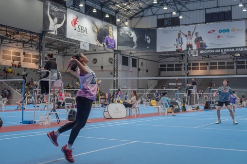 Players competing on the blue courts at the JKTech KSA tournament